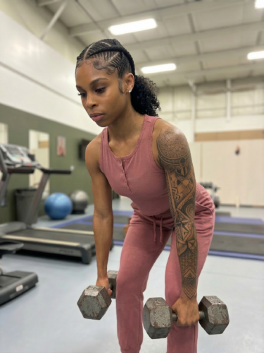 Woman performing a Romanian Deadlift
