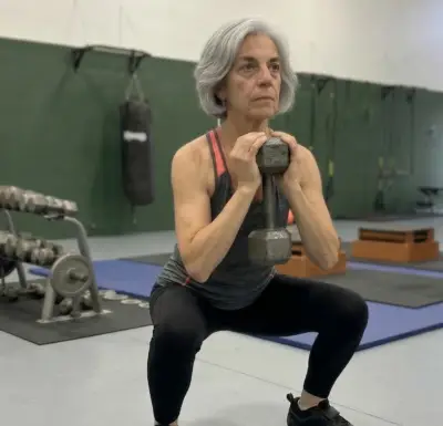 Woman performing deep squats